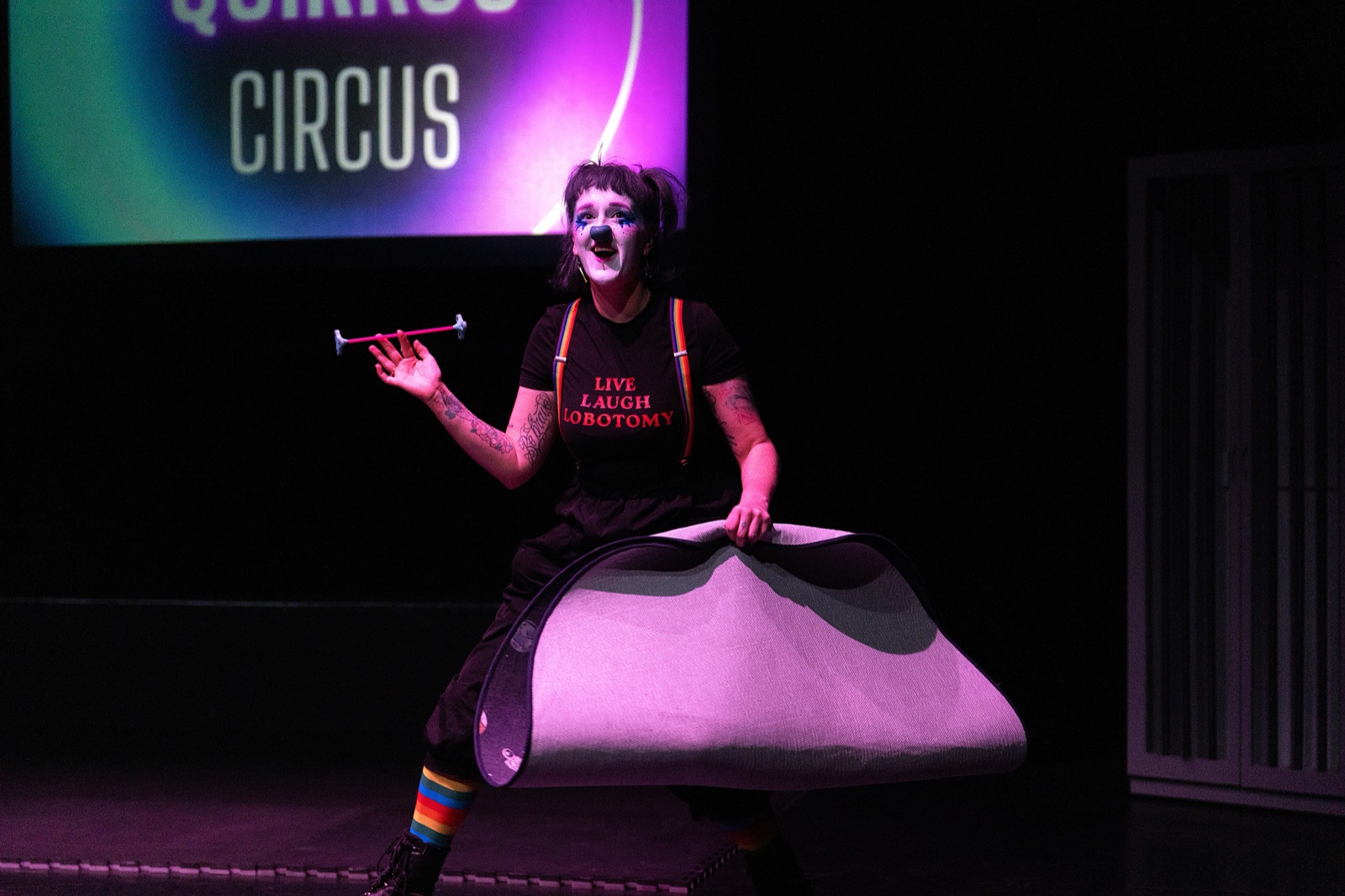 Chow the Cosmic Clown performing in a prop costume on stage